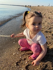 Vince's daughter plays on the beach
