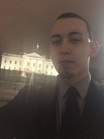 A selfie of Vince in front of the White House at night