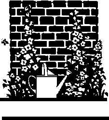 brick wall with flowers and watering can