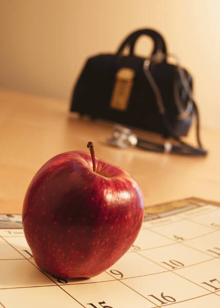 Doctors bag and apple