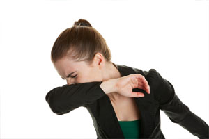 woman sneeze in arm
