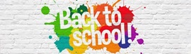 Text stenciled onto a white brick background with rainbow splashes of paint.  Text reads: "Back to School!"
