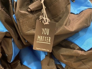 Photo of a luggage tag which reads "You matter"