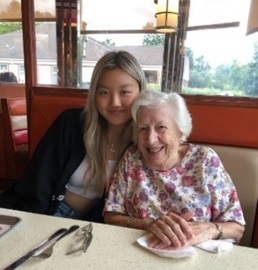 Photo of Lily with an older relative