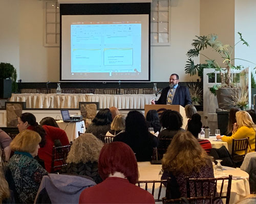 Commissioner Scheff speaks to the attendees 