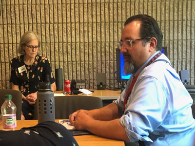 Commissioner Scheff speaks with families as DDS West Region Executive staff member, Sheryl Kemp, listens to the discussion. 