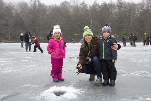 Family fishing at Burr Pond during the No Child Left Inside Winter Festival.