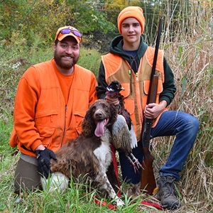 Pheasant hunters and hunting dog