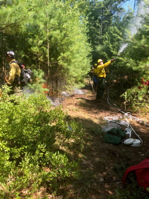 DEEP staff work to contain the recent Riverside Thompson fire.