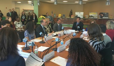 Governor Malloy discussing youth homelessness with local and state officials