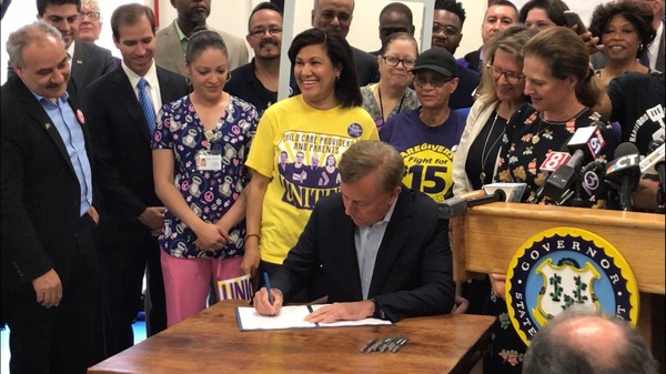 Governor Lamont signing minimum wage bill