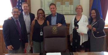Governor Lamont signing the budget