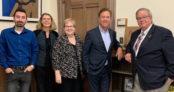 Grating the Nutmeg co-hosts and staff with Governor Ned Lamont