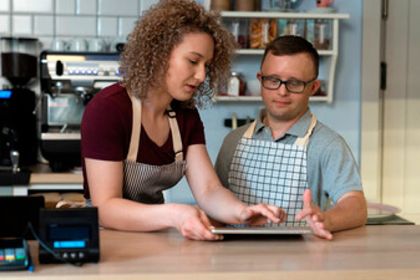 Woman and man work on tablet