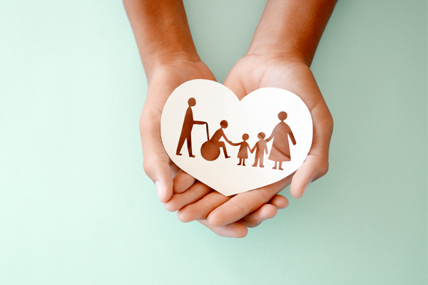 Cutout of family in hands