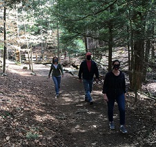 Hikers in state park with masks
