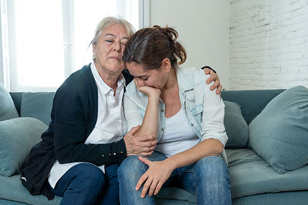 mother with adult daughter in distress
