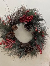 Photo of a green wreath with red berries