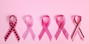 Several pink ribbons in various shades and patterns appear against a pink background