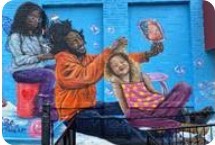 Photo of part of the mural on the Hartford Office.  A Black father sits doing his daughter's hair while his other daughter does his hair.  The family is happy and smiling.