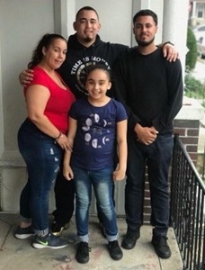 Vince standing with his family