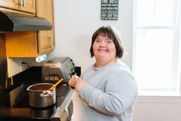 Person cooking at stove