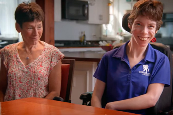 two individuals sitting at table