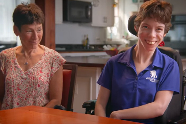 Two individuals sitting at table