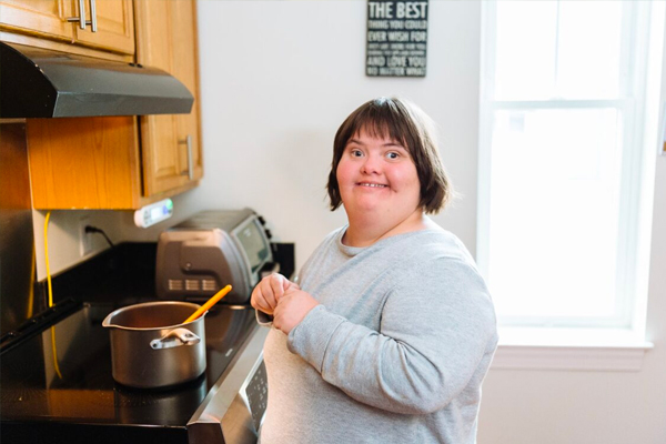 Individual cooking in kitchen
