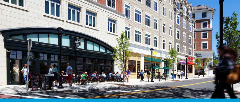 People sitting outside downtown cafe