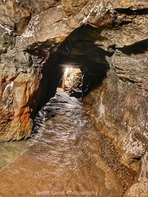 Rocks surrounding a tunnel within the abandoned copper mine at Old New-Gate.