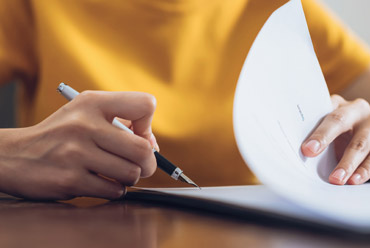 Person signing a form