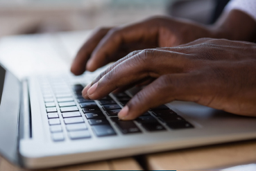 Person typing on computer