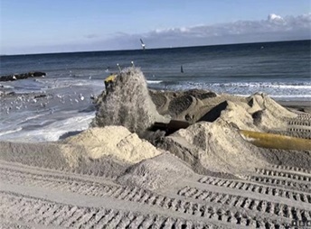 Pile of dredged sand on a beach
