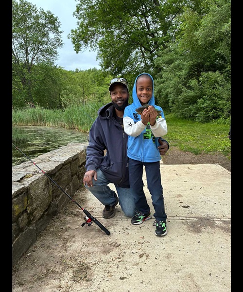 happy dad and child with fish