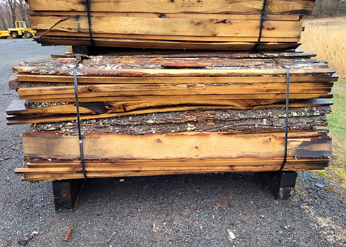 Bundles of slab wood being sold for firewood at the DEEP Sawmill.