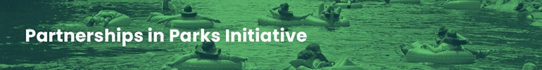 Partnerships in Parks header image of people tubing on a river