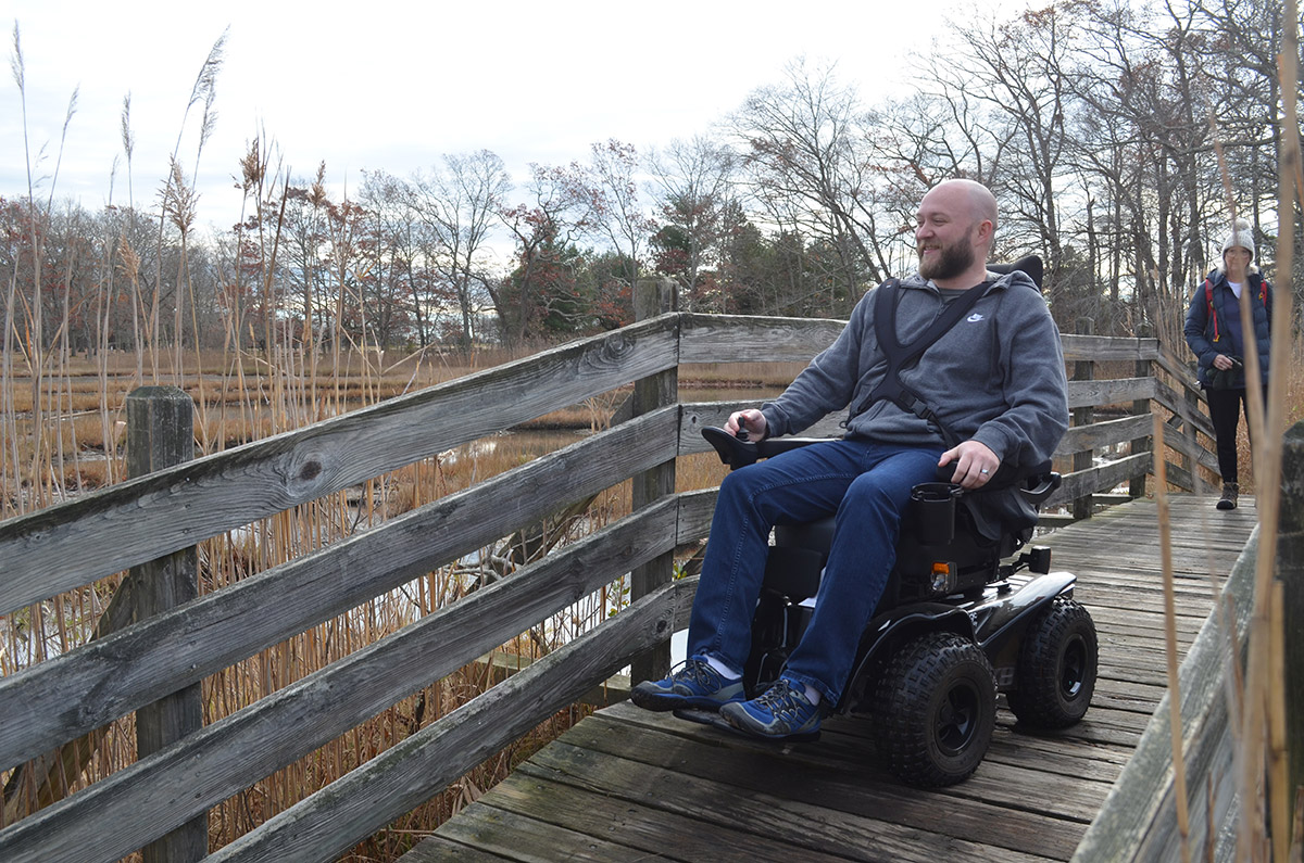 ATW user on boardwalk - DEEP all-terrain wheelchair reservations open May 6, chairs available starting June 6th.