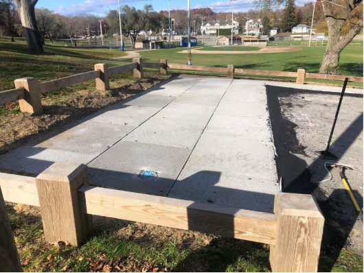 This porous concrete pad overlooking the ballfield is nearly complete (Maura Robie, ECCD).