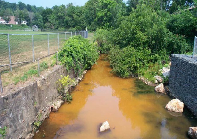 Upstream of Heminway dam with orange-colored water