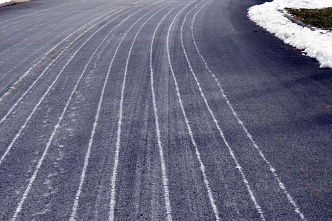 white salt lines on the roadways in winter