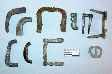 Various copper alloy shoe-buckle frame fragments and a small pewter clothing buckle