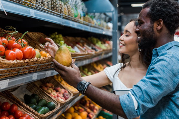 A couple shopping for produce