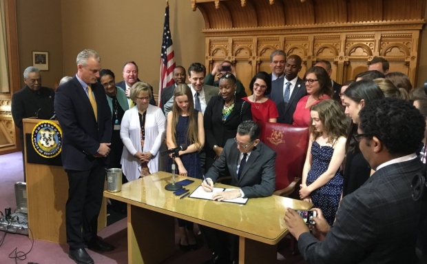 Governor Malloy signing pay equity legislation