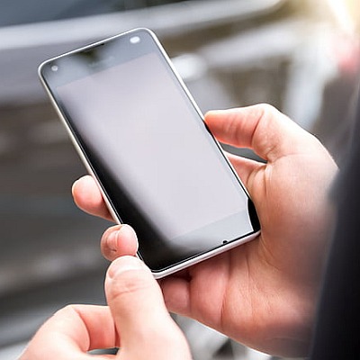 A person's hands holding a smartphone
