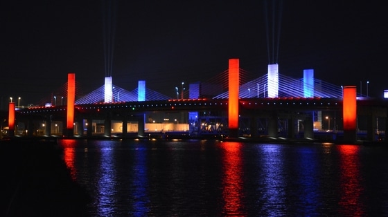 Pearl Harbor Memorial Bridge in New Haven illuminated red, white, and blue