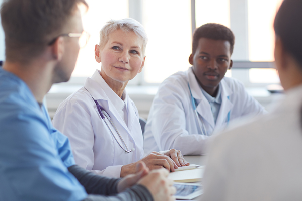 Medical professionals at a meeting.