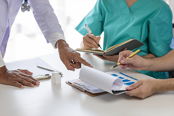 Medical professionals comparing notes.