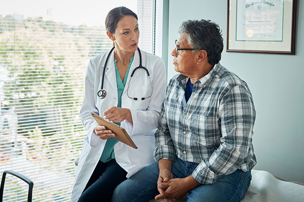 doctor talks to patient