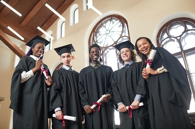 High school students wearing graduation caps and gowns
